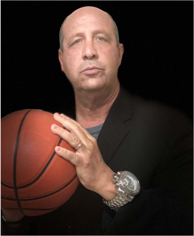 Johnny Kent holding a basketball